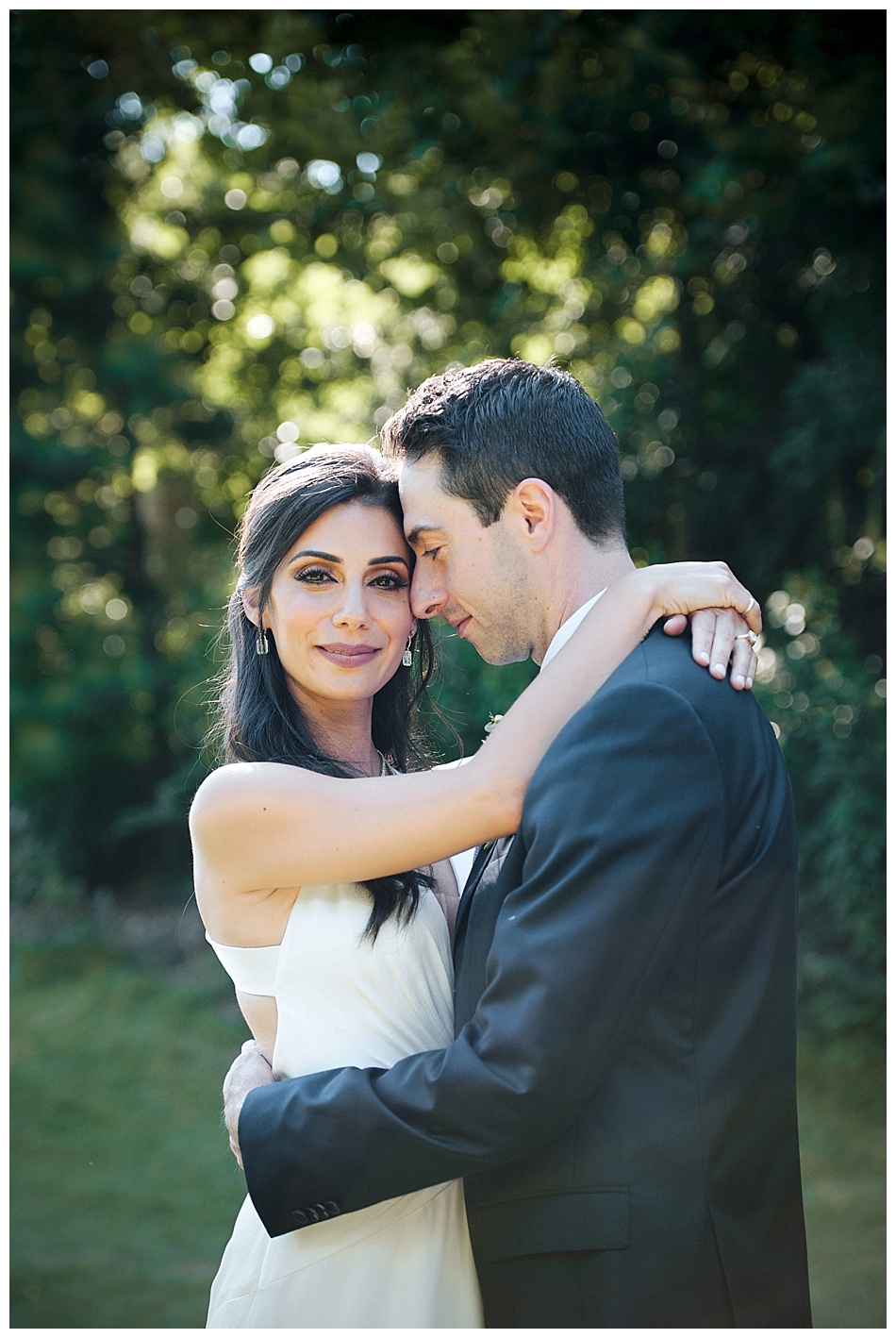 Bride in Jenny Packham dress, with her groom in a black tux, before their wedding ceremony at a private residence, in Atlanta Georgia.